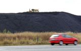 A tractor works on the stockpiles of coal near the Warrego Highway, in southern Queensland