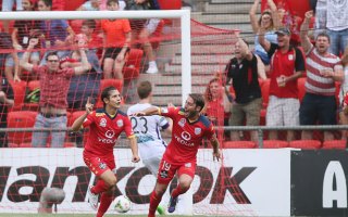 Adelaide's Pablo Sanchez celebrates the opening goal with teammate Miguel Palanca.