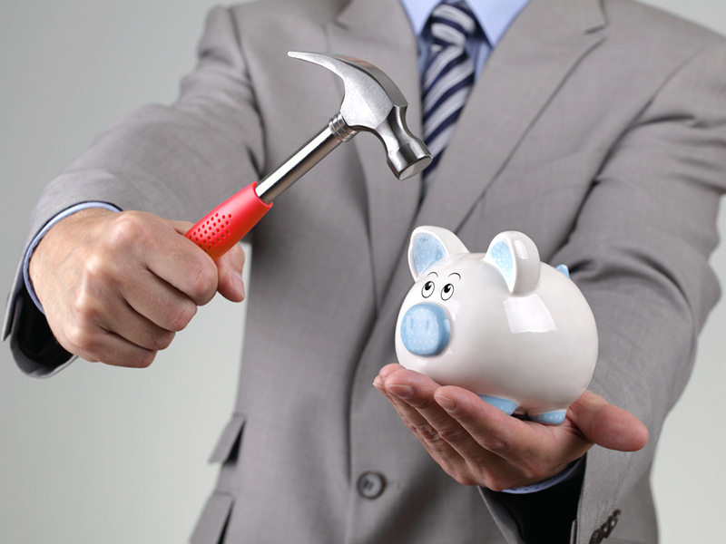 Piggy bank with hammer