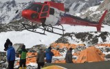 A rescue helicopter prepares to land and airlift the injured from Everest Base Camp, befall earthquake. Getty