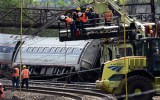 Rescuers work around derailed carriages of an Amtrak train in Philadelphia.