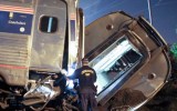 Emergency personnel work the scene of a deadly train wreck in Philadelphia.