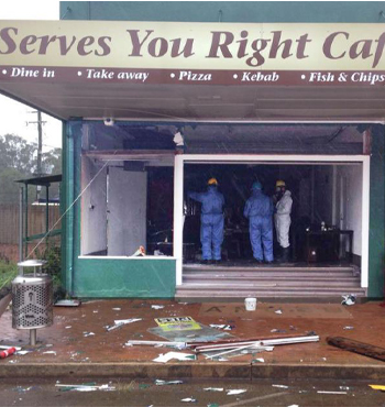 Fire investigators assess the Serves You Right Cafe in Ravenshoe.