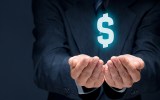Businessman in suit with money symbol