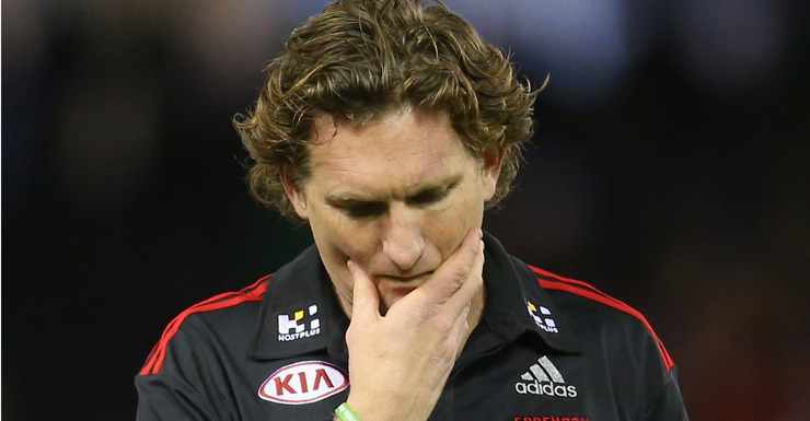 James Hird looks dejected as he leaves the field.