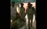 A casualty is taken for medical treatment.