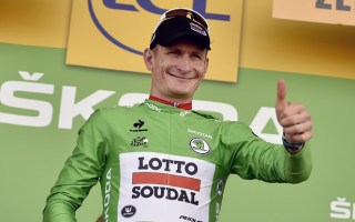 Germany's Andre Greipel celebrates his green jersey of best sprinter.