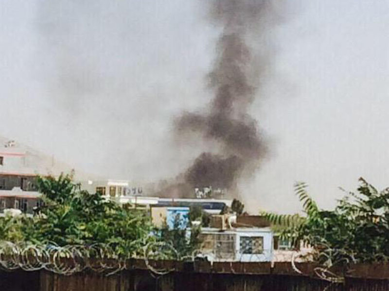 Smoke can be seen after an explosion at the Kabul airport.