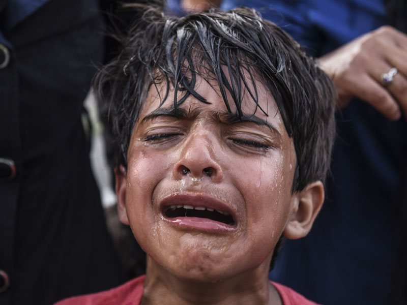 Children were caught in the cross-fire, doused in tear gas. Getty
