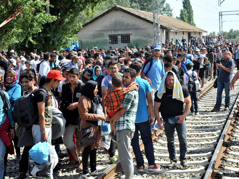 Migrants wait at a railway station, near the Serbia and Croatia border.