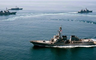 A Navy destroyer nears contested territory in the South China Sea.