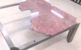 Senator Penny Wong showed photos of the damaged table at the senate committee on Monday. Photo: Twitter