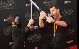 Singer and unofficial Jedi Master, David Campbell, 'guides' his son at the premier.