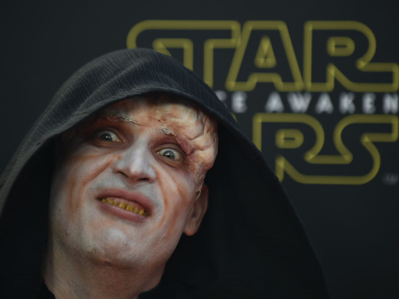 A fan arrives dressed as The Emperor character. Getty