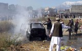 Pakistani firefighters extinguish a blaze at the bombing site.