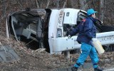 The wreckage at the side of the road.