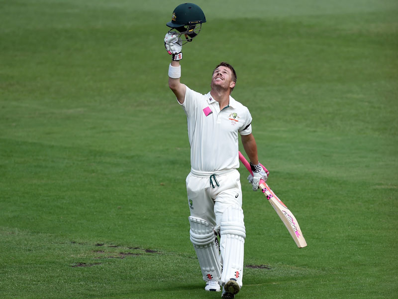 Warner celebrates scoring a century on the fifth day.