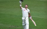 Warner celebrates scoring a century on the fifth day.