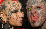 Two eyeball tattoo recipients at a festival in Brazil.
