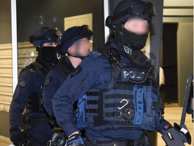 Police used heavy chainsaws to break into the apartments.