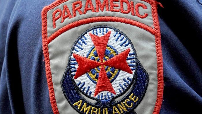 Man pinned under hay baler