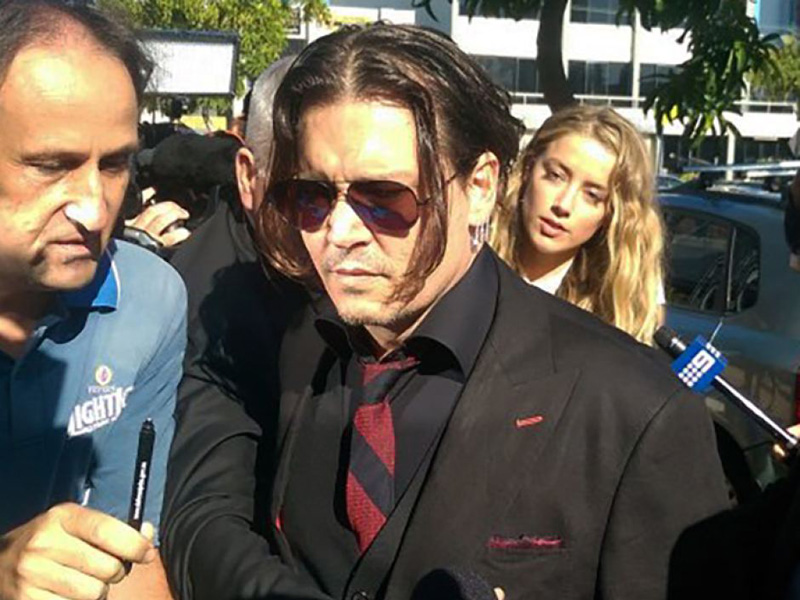 Johnny Depp and his wife Amber Heard arrive at Southport Magistrates' Court.