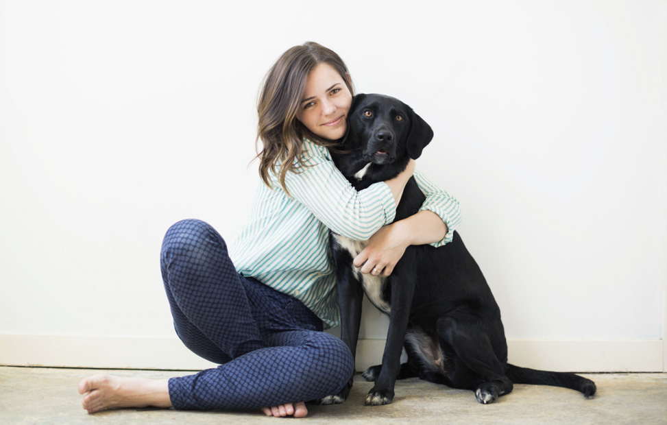 woman hugging dog