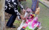 Mourners lay flowers at creek where toddler's body was found