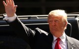 Mr Trump returns to his office after voting on primary day in New York.