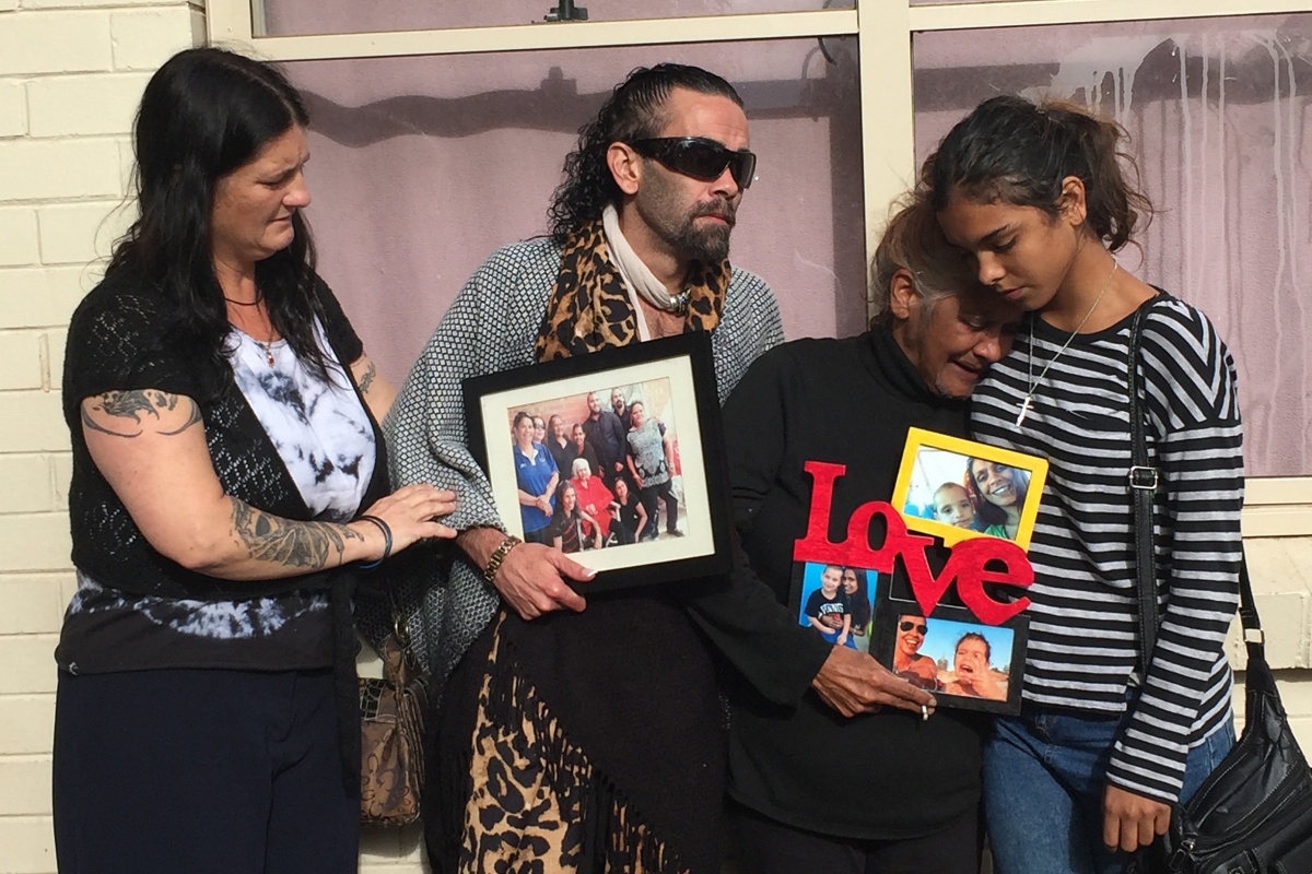 Grieving mother Donna Rigney (2nd right) comforted by other family members in Adelaide
