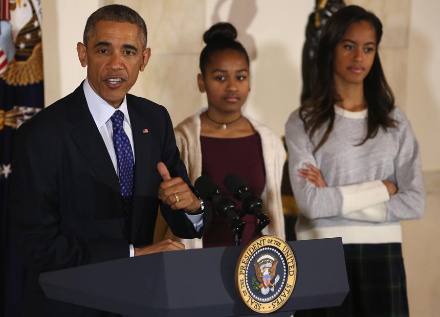 Barack Obama and daughters, Sasha (middle) and Malia (right), have been invited to the Great Barrier Reef.