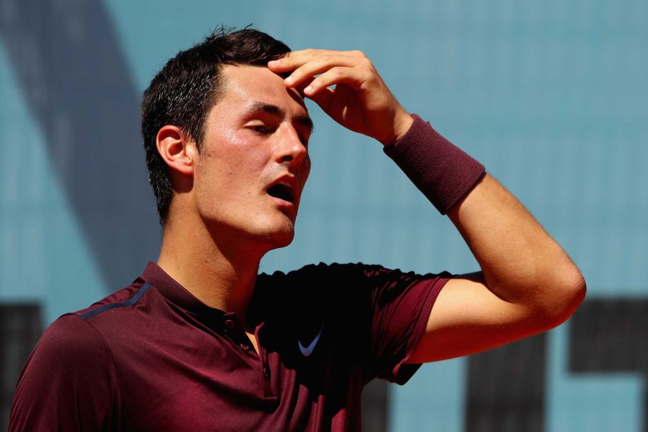 Tomic said he was feeling ill. Photo: Getty.