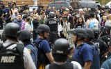 UCLA students and faculty members are escorted by police. Photo: AAP.