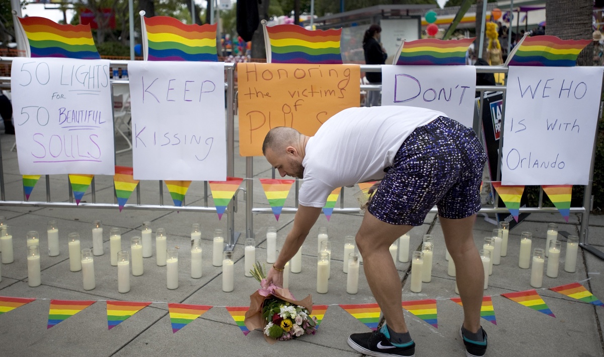 A memorial with 50 candles for at least 50 people gunned down at a gay nightclub in Orlando, Florida.f