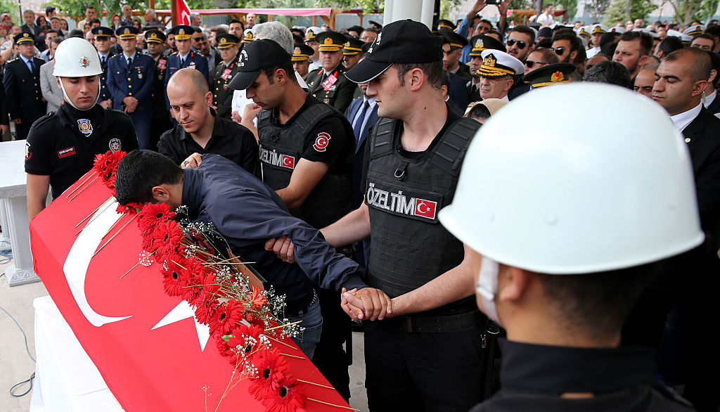 Mourners at funerals that have begun in Turkey.
