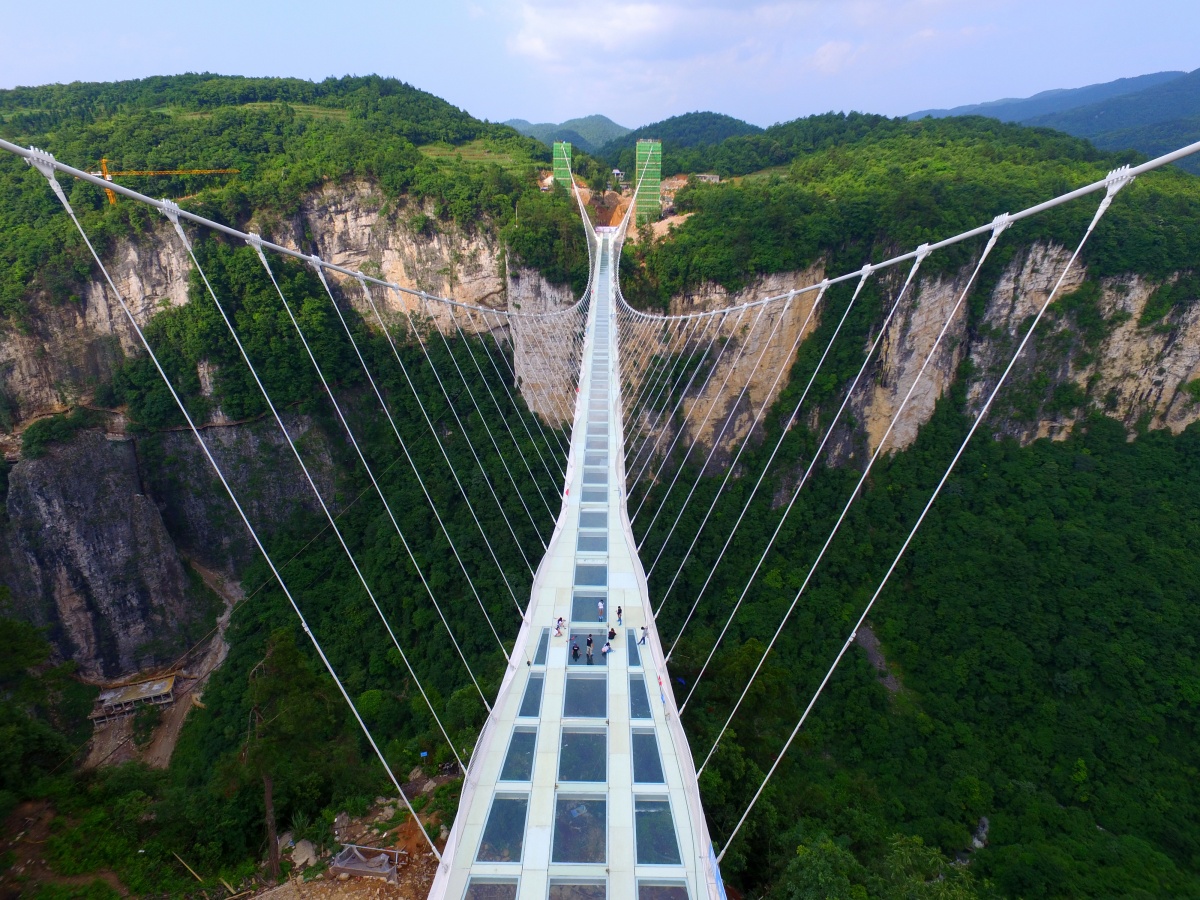 The world's highest and largest glass-bottomed bridge across the Zhangjiajie Grand Canyon.
