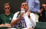 Nick Kyrgios takes a drink during a break at Wimbledon against Richard Gasquet.