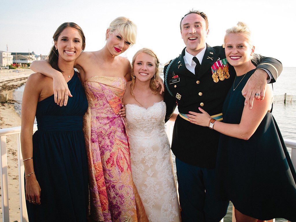 Taylor Swift with surprised guests at a California wedding.