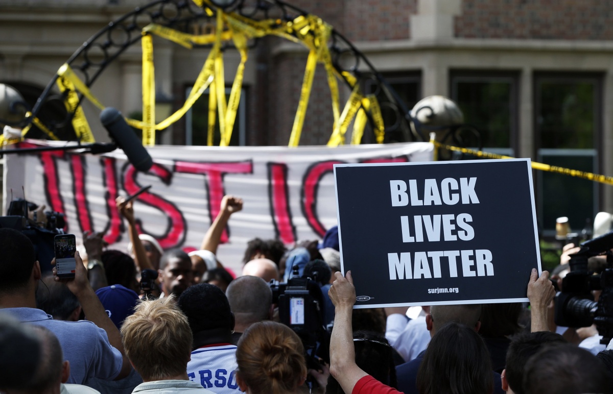 Protesters gather outside the governor's residence in Minnesota.