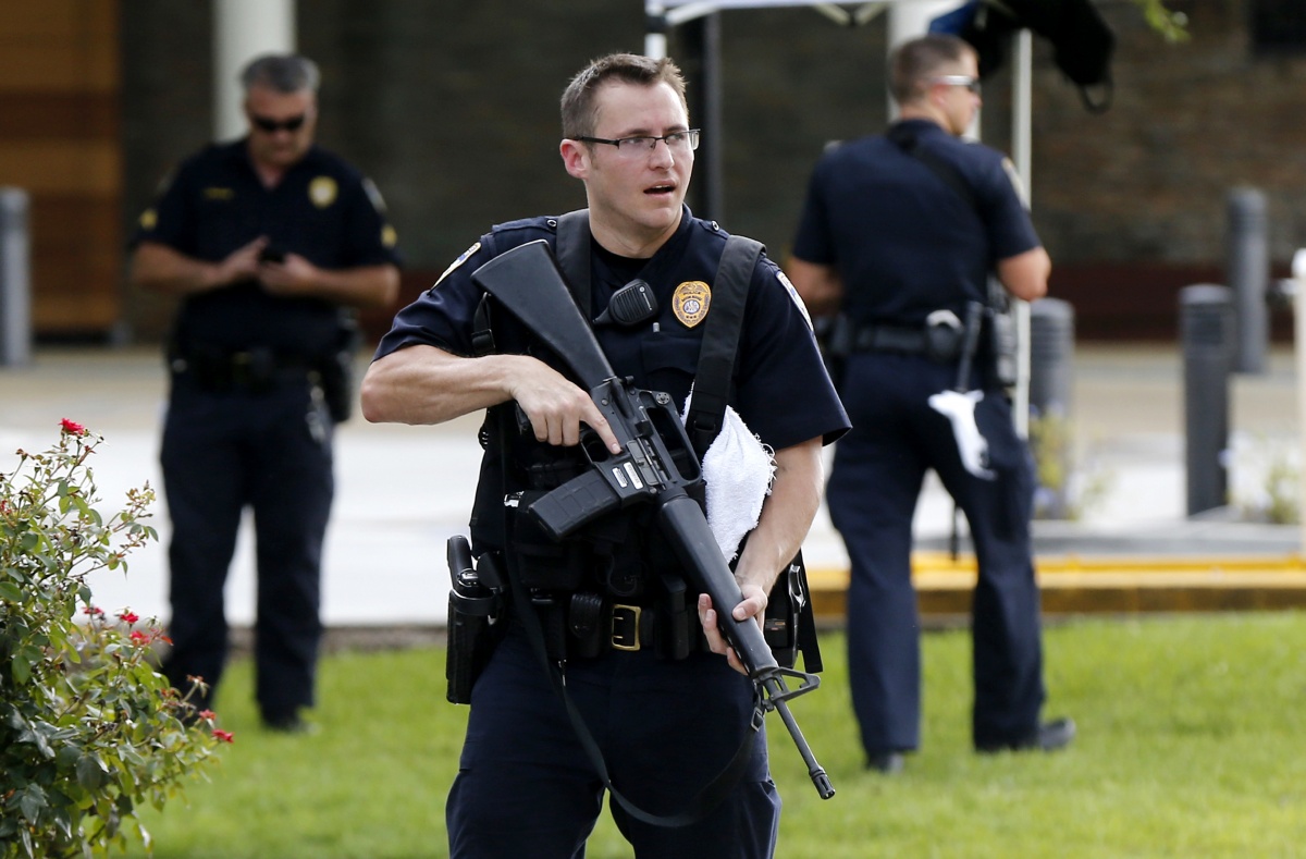 Police guard the emergency room of the medical center where wounded officers were brought.