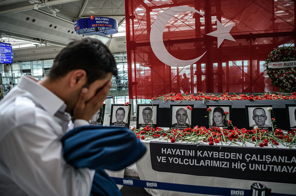 An airport employee mourns for his colleagues.