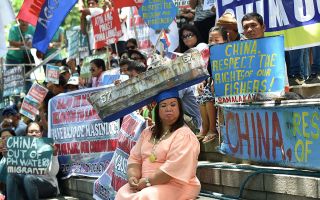 Protestors in the Philippines celebrating the decision. Photo: Getty