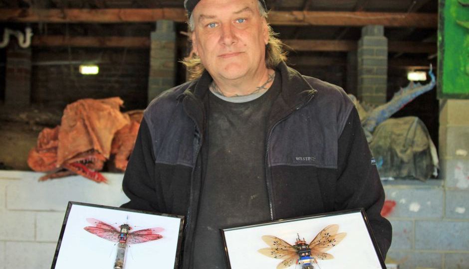 Steve Wakeling with mounted recycled bugs
