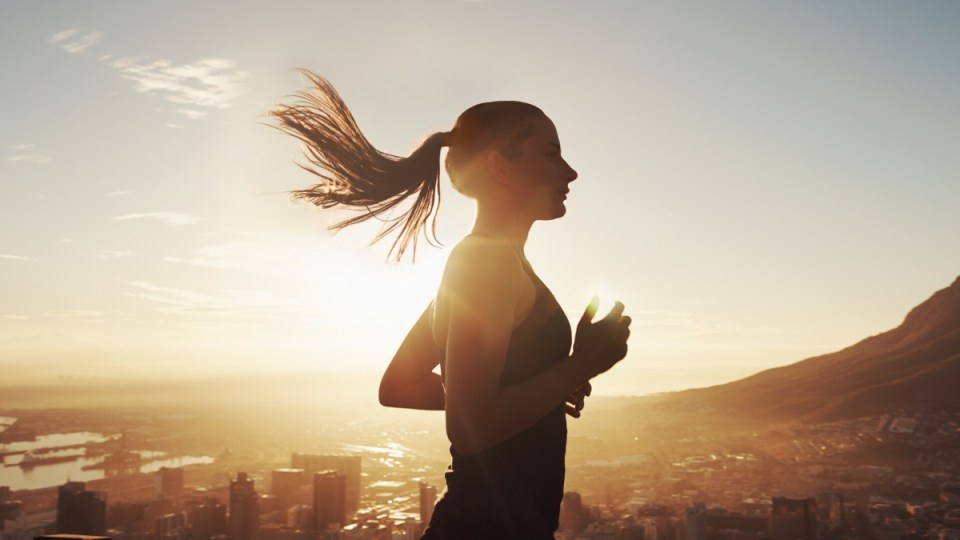 Female jogger in the sun
