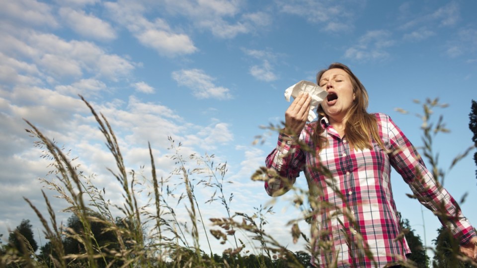 Woman sneezing