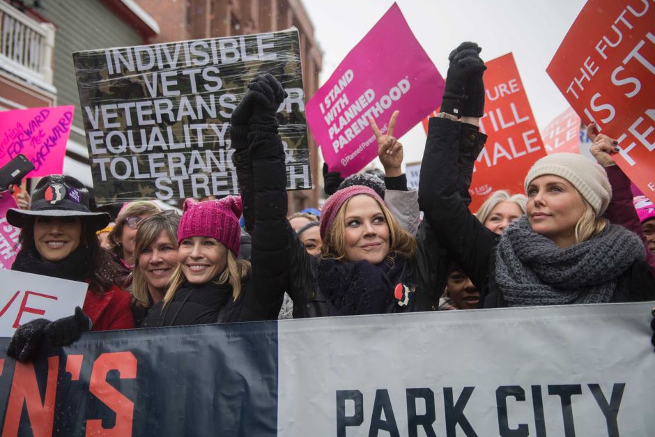 Actresses Chelsea Handler (left) and Charlize Theron (right) participate in the Women's March during the 2017 Sundance Film Festival.