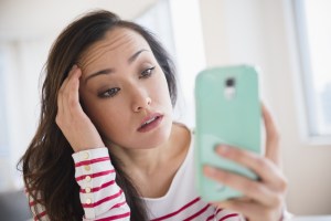 woman iphone sad