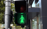female traffic crossing lights