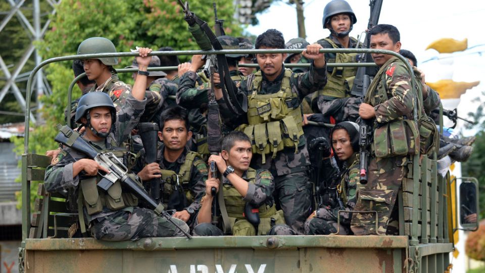 Members of the Philippine police special action force on their way to the frontline in Marawi on June 19, as the armed conflict between government troops and Islamist militants continues