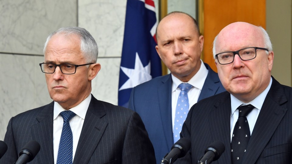 Malcolm Turnbull, Peter Dutton and George Brandis are pictured making the announcement on Tuesday.